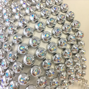 Detail of sparkling AB rhinestones and silver metal base on a halter neck top