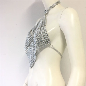 Detailed side view of silver halter top made of sparkling colorful rhinestones