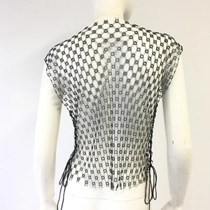 Detailed back view of a black knit rhinestone tank top with geometric floral patterns