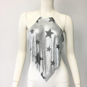 Detailed view of silver mesh sequin halter top featuring black star patterns and chain strap