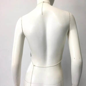Detail view of silver metal body chain back showing adjustable extender links on a mannequin