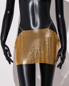 Detailed view of the gold metallic sequin mesh mini skirt with chain links and wavy hem
