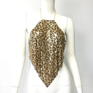 Close-up of leopard print metal sequins with gold chain neck strap and pointed hem