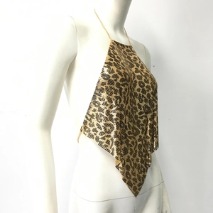 Detail of leopard print metal sequins and gold chain halter neck on a party bra top