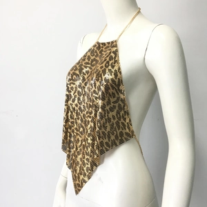 Detail view of metallic leopard print sequins on backless halter top with chain strap