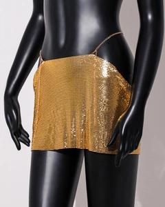 Close-up of golden metal mesh sequin mini skirt with delicate adjustable waist chain