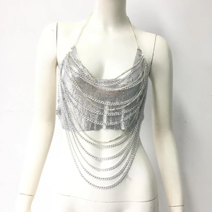 Detail of silver metal sequin halter top with layered chain fringe for festival wear