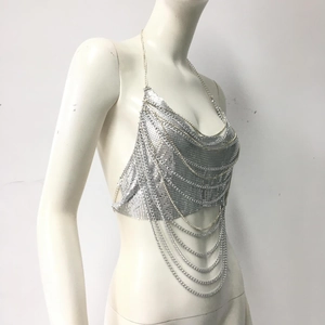 Detail of silver chainmail halter top with layered metal sequins for parties