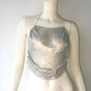 Detail of silver sequin halter top with sparkling rhinestones and metal chain neck strap