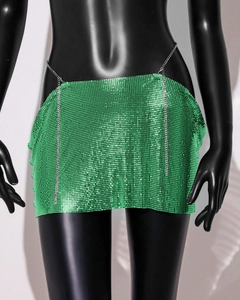 Detail view of green metal sequin mesh mini skirt with thin silver waist chain accessory