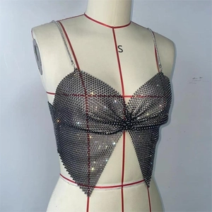 Detailed view of rhinestone fishnet crop top featuring a front knot and silver chain straps