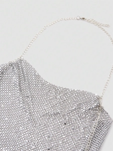Sparkly silver sequin halter top featuring metallic chain straps for a sexy party look