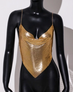 Detailed view of the gold metal mesh chainmail top with V-neckline and sequins