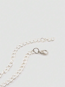 Silver sequin camisole top featuring detailed metal chain straps and lobster clasp