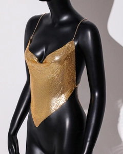 Close-up of golden metallic mesh top with V-neck and sequin detail on a black mannequin