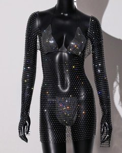 Detail of black mesh dress with sparkling rhinestones and matching bikini set