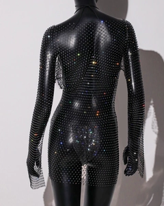 Detailed view of black mesh bodycon dress featuring shimmering colorful rhinestones