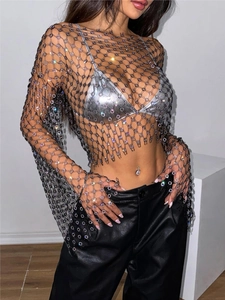 Detail of sheer black mesh top featuring sparkling rhinestones and crystal flower patterns