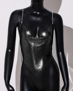 Detailed view of gunmetal mesh sequins and delicate chain straps on the halter top