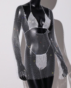 Close-up of rhinestone fishnet dress with sparkling crystals and bikini three-piece set