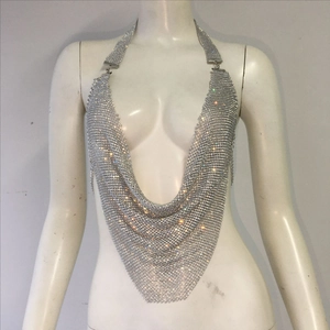 Close-up of luxury silver rhinestone metal mesh body chain with a plunging halter design