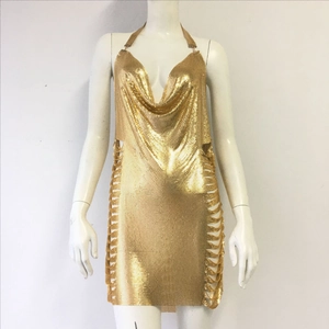 Detail of gold chainmail halter dress showing metallic sequins and hollow side chains
