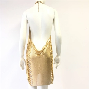 Close-up of golden metallic mesh backless mini dress with deep V drape detail