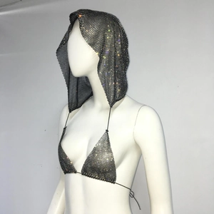 Detailed macro view of black rhinestone fishnet hood and sparkly halter bikini top