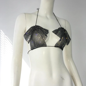 Detail of sexy black halter neck top with colorful rhinestones and bow design