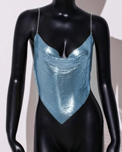 Detailed close-up of shiny blue metal sequin halter top with delicate chain straps