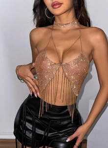 Detailed close-up of gold chainlink halter top with sparkling rhinestones and fringe