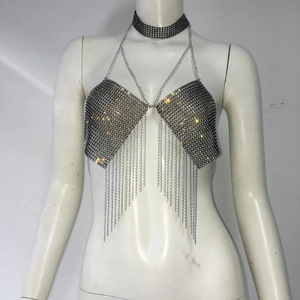 Macro detail of sparkly rhinestone fringe and mesh choker on a halter party top