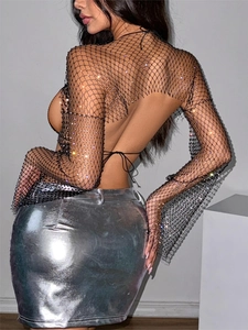Black rhinestone fishnet crop top and silver metallic mini skirt two-piece set