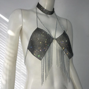 Detail view of rhinestone mesh body chain with colorful crystals and fringe tassels