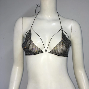 Detail of sexy black rhinestone mesh bikini top featuring crystal fishnet halter design