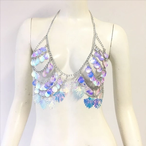 Detail of laser iridescent shell sequin halter top with metallic chain for beach parties