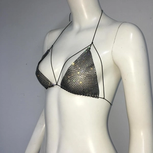 Detailed view of sexy black fishnet halter top with sparkling rhinestones for party wear