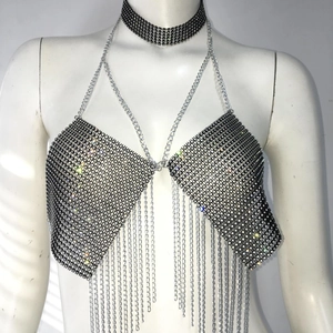 Detail of black rhinestone mesh halter top featuring metal fringes and matching choker