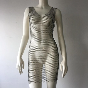 Close-up of black mesh fishnet mini dress with shimmering colorful rhinestones