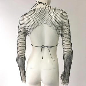 Detail of black mesh long-sleeve shrug with delicate beadwork and open back ties