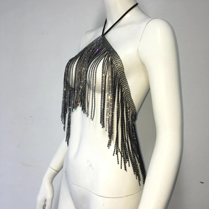 Detail shot of multi-layer rhinestone fringe and halter chain design on black straps
