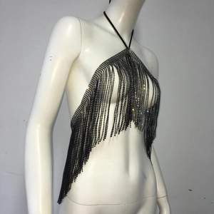 Detail of black rhinestone tassel halter top showing shimmering crystal fringe on dark chains