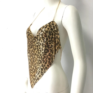 Detail of gold leopard print metal mesh halter top with hanging chain texture