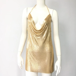 Close-up of gold metallic mesh fabric with deep V-neck and halter chain straps