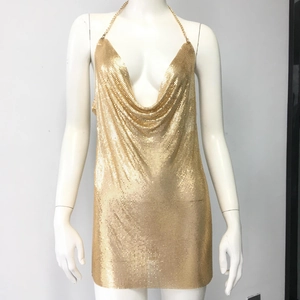 Detail of gold metal sequin mini dress with cowl neck and chain halter straps