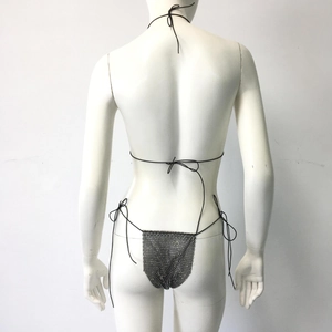 Detail view of black fishnet thong with rhinestones and tie-side chains on mannequin