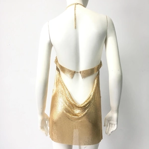 Detail of gold metal mesh backless dress with draped cowl back and chain straps