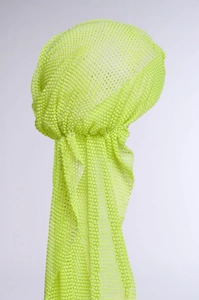 Close-up of neon yellow mesh turban with sparkling rhinestones for party wear