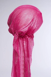 Detailed view of pink mesh turban with sparkling sequins and decorative long tail