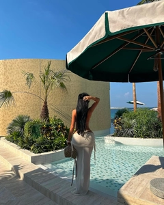 Rear view of a beach set featuring a semi-transparent sarong skirt with side drawstring